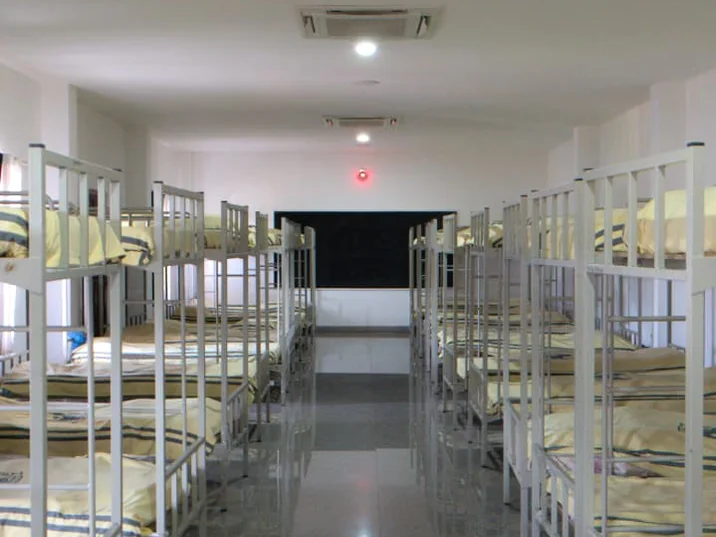 Rows of bunk beds on either side of the girls’ hostel aisle at Greenhills